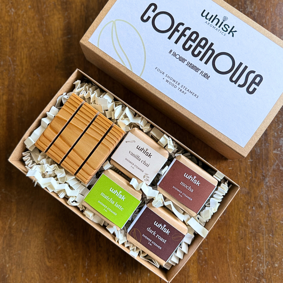 Box of whsk coffeehouse shower steamers on a wooden surface