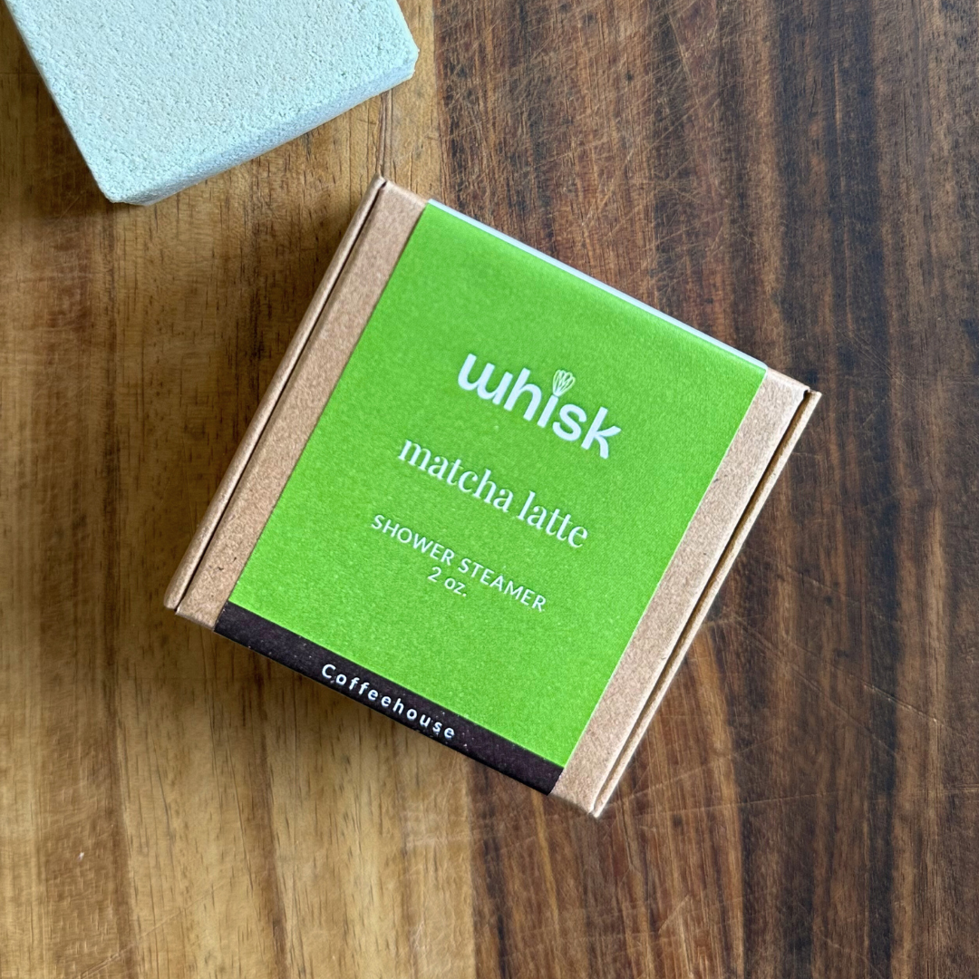 Whisk matcha latte shower steamer on a wooden surface